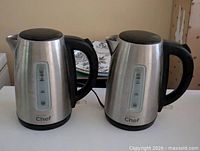 Both stainless steel Master Chef kettles side by side