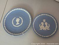 Both Wedgwood blue jasperware plates side by side