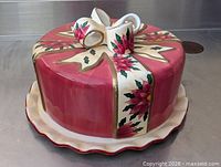 Full view of covered cake plate on base