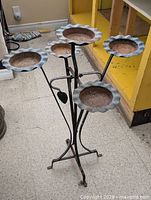 full view of metal plant stand