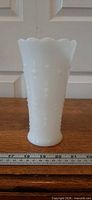 Full front view of white milk glass vase