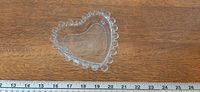 Top view showing heart shape, beaded rim, etched center motif