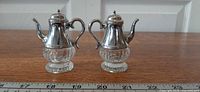 Both shakers front view beside ruler