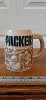 Front view showing PACKERS lettering and relief scene