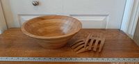 Bowl and utensils on tabletop with ruler for scale