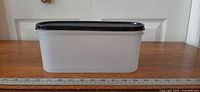 Side view of Super Oval container showing length against 12 in ruler