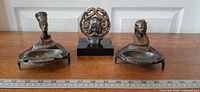 Group shot of both ashtrays and skull figurine with ruler for scale