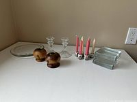 Group shot showing all candle holders: wooden pair, glass pair, six minis with candles, glass plate, three rectangular glass holders