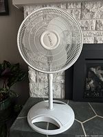 Front view of Lasko pedestal fan showing grill and blades