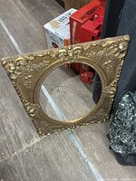 Full view of ornate gold-tone frame standing upright