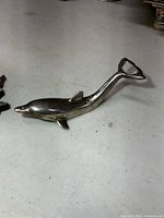 Full view of dolphin bottle opener, side profile