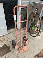 Front view of metal hand cart standing upright