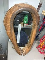 Front view of leather horse collar mirror