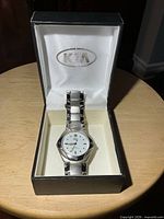 Watch in open Kia box showing overall presentation