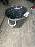 Top angle showing overall bucket shape, rope handle, interior condition