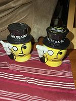 Both Mr. Peanut canisters front view