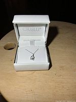 Necklace in open Crislu box