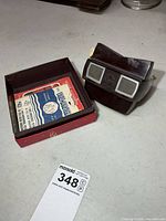 Viewer and box containing paper reel sleeves
