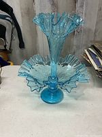 full view of blue glass epergne showing horn and bowl