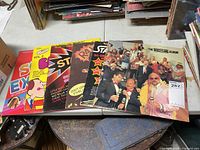 Group shot of six LP albums laid out on table