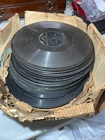 Stack of records in damaged cardboard box