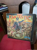 Front of album jacket showing title art and artist
