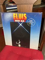 Front cover of Moody Blue LP showing artwork and title sticker