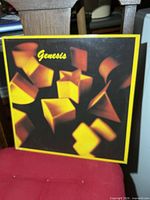Front cover with yellow cube artwork