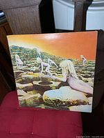 Front of gatefold jacket with children on rocky terrain