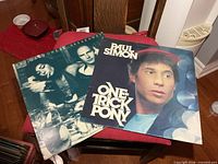 Front covers of both LP jackets on chair