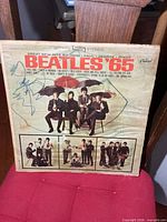 Front cover of Beatles ’65 LP with pen marks and wear