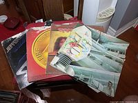 Stacked view of all four record jackets