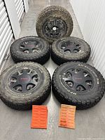 Front view of all five tires and wheels