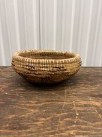 Angled side view of entire pine needle basket