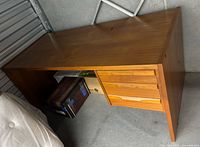 Full view of desk showing top, legs, drawer stack