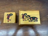 Top view of both wooden boxes showing Haida motifs