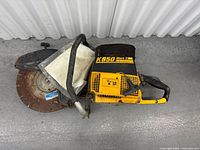 Right side view showing full saw, rusted blade, guard, and body