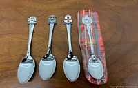 Four souvenir spoons including one in Avoncliff tartan package