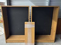 Front view of both bookcases with loose wrapped shelf board