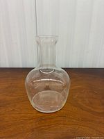 Full front view of clear glass vase