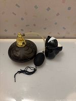 Both perfume containers side by side
