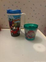 Front view of both drinkware items