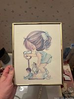 Front view of framed nursery print showing illustration and signature