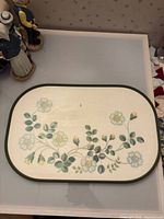 Full view of St Michael melamine tray showing shape, border and floral design