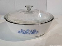 Casserole dish with lid assembled, showing blue floral motif and overall form