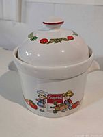 Whole tureen with lid in place showing decals and side handles