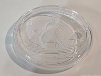 Top view showing full ashtray and sailing ship design
