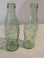 Front view of both contour bottles