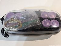 Overall view of Conair CHV14X hot roller set with lid, rollers, clips and power cord