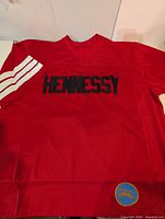 Front view showing Hennessy lettering and white sleeve stripes
